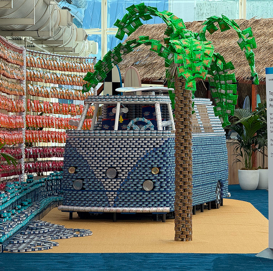 Event design installation of a van and palm tree built from packaged goods